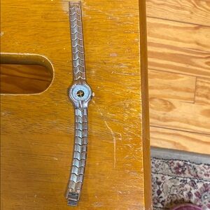 GenevaSilver and  sparkles around the  base Watch